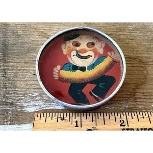 Vintage hand held dexterity puzzle clown playing accordian mirror back Japan 2"